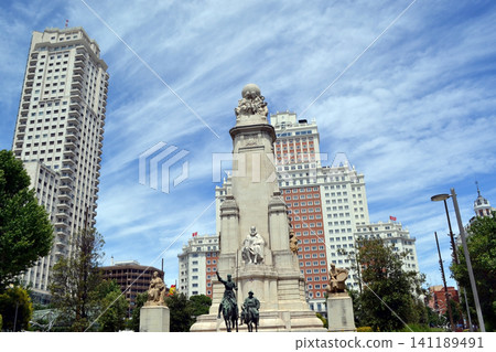 Wide view of madrid plaza de espana monument with surrounding highrise buildings and dramatic sky for travel background and city banner design Wide view of madrid plaza de espana monument with surrounding highrise buildings and dramatic sky for travel background and city banner design 141189491