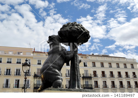 Oso y madrono madrid landmark statue of bear and strawberry tree in puerta del sol square for travel poster and city background Oso y madrono madrid landmark statue of bear and strawberry tree in puerta del sol square for travel poster and city background 141189497