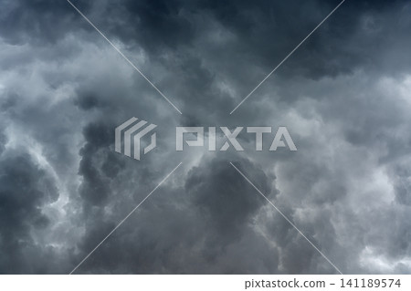 panoramic view of a cloudscape of a sky with a gloomy dark storm clouds panoramic view of a cloudscape of a sky with a gloomy dark storm clouds 141189574