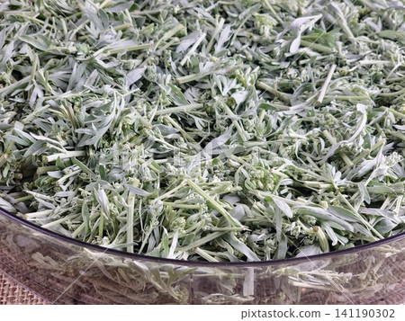 Close-Up of Chopped Wormwood in a Clear Glass Bowl Close-Up of Chopped Wormwood in a Clear Glass Bowl 141190302