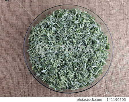 Top View of Chopped Bitter Wormwood in a Glass Bowl Top View of Chopped Bitter Wormwood in a Glass Bowl 141190303