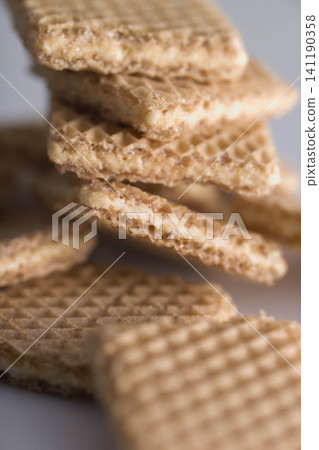 A cross-section of a stack of wafers, characterized by their light and crispy texture. A cross-section of a stack of wafers, characterized by their light and crispy texture. 141190358