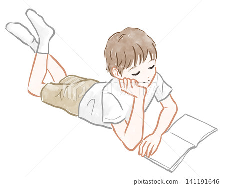 A boy reading a book while lying down A boy reading a book while lying down 141191646