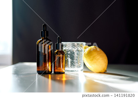 Essential oil amber dropper bottles with lemon water Essential oil amber dropper bottles with lemon water 141191820