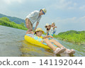 A family of four playing in the river in summer. 141192044