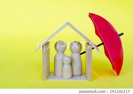 Family protected by a red umbrella representing security and insurance with customizable space for text. Family protected by a red umbrella representing security and insurance with customizable space for text. 141192217