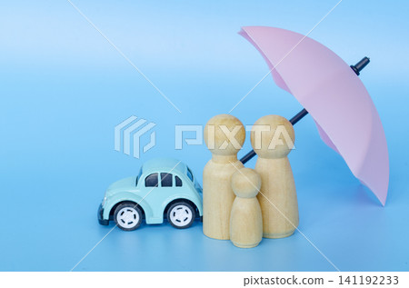 Small figures with a green umbrella representing security and insurance with customizable space for text. 141192233