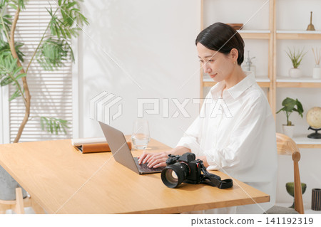A woman editing photos A woman editing photos 141192319