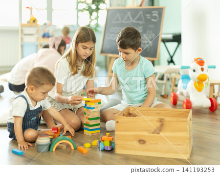 Childrens leisure, supervised children, children playing in living room of kindergarten. Childrens leisure, supervised children, children playing in living room of kindergarten. 141193253