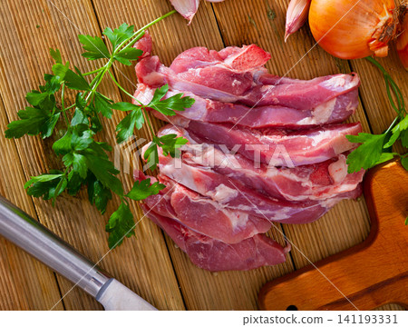 Raw turkey thigh chops 141193331