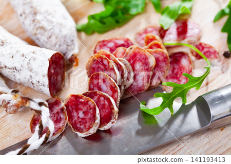 Sliced spanish sausage fuet Sliced spanish sausage fuet 141193413