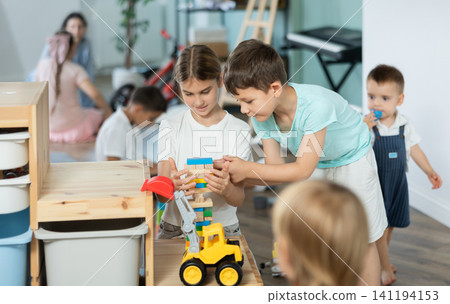 Childrens leisure, supervised children, children playing in living room of kindergarten. Childrens leisure, supervised children, children playing in living room of kindergarten. 141194153