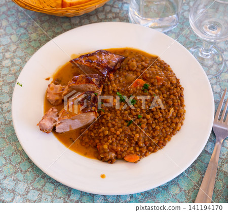 Delicious pork tenderloin with mousserons sauce and lentils Delicious pork tenderloin with mousserons sauce and lentils 141194170