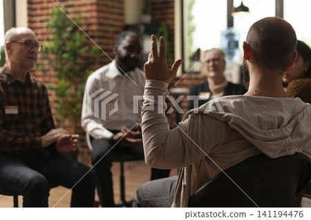 Man with addiction talks to a therapist and group members about depression and health problems during a counseling meeting, connecting addiction and therapy within a clear therapy recovery scenario. Man with addiction talks to a therapist and group members about depression and health problems during a counseling meeting, connecting addiction and therapy within a clear therapy recovery scenario. 141194476