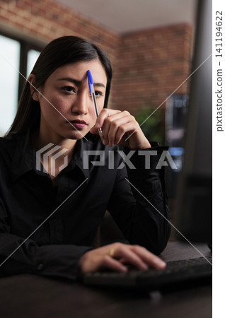 Thoughtful blockchain developer reflects on low security levels and mainframe defense improvements after failed data processing operations. Thoughtful blockchain developer reflects on low security levels and mainframe defense improvements after failed data processing operations. 141194622