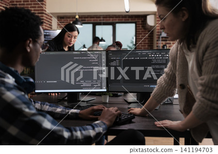Programmers develop data decryption software together, expert programmers developing data decryption high tech software in order to save corrupted files. Programmers develop data decryption software together, expert programmers developing data decryption high tech software in order to save corrupted files. 141194703