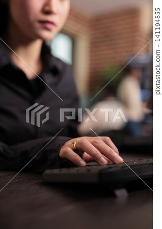 Freelance coder programs a server algorithm at a computer desk, building software code and development logic in an IT office, connecting paperwork, planning and professional workflow. 141194855