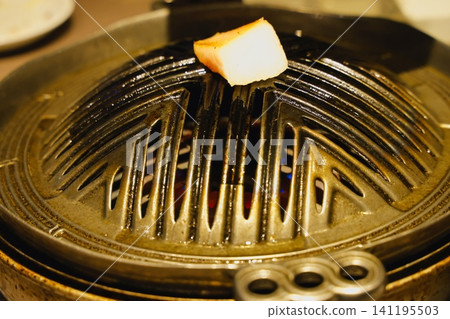 A Genghis Khan hot pot with pork back fat added. 141195503