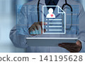 A doctor checks the electronic medical record (EHR) on a digital tablet during a consultation. A man manipulates patient records and medical data. 141195628