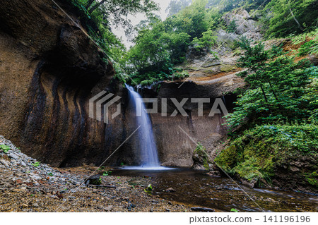 Nanajo Falls, a magnificent waterfall nestled quietly amidst the rich natural beauty of Tomakomai City, Hokkaido. Nanajo Falls, a magnificent waterfall nestled quietly amidst the rich natural beauty of Tomakomai City, Hokkaido. 141196196