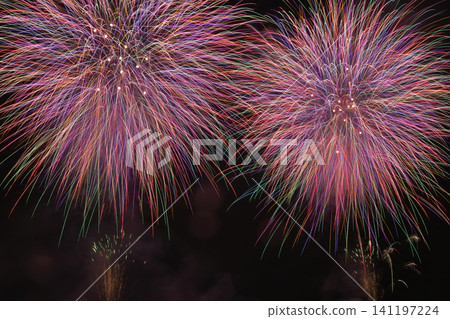 Fireworks blooming in the summer night sky; Fireworks blooming in the night sky; A fireworks display that shines brightly in the sky; Fireworks; Night sky; Fireworks image; Fireworks display Fireworks blooming in the summer night sky; Fireworks blooming in the night sky; A fireworks display that shines brightly in the sky; Fireworks; Night sky; Fireworks image; Fireworks display 141197224