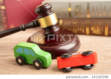 Car accident lawsuit and insurance, Judge hammer with car model. 141197296