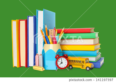 School supplies are neatly arranged alongside colorful books School supplies are neatly arranged alongside colorful books 141197397