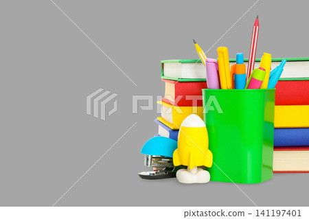 Bright stationery and stacked books ready for students to use Bright stationery and stacked books ready for students to use 141197401