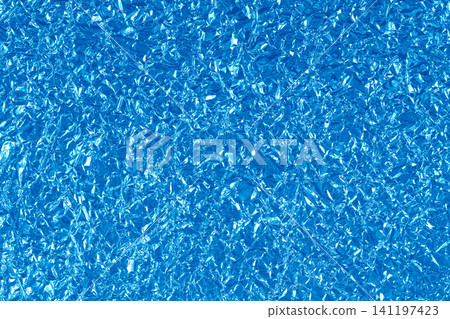 Blue foil leaf shiny texture, abstract wrapping paper for background and design art work. 141197423