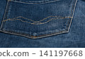 Closeup view of denim jeans pocket showing fabric and stitching details 141197668