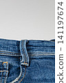 Closeup view of denim jeans showing pocket and waistband details 141197674