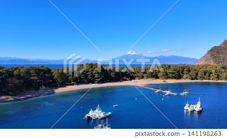 Mihama Cape in Izu, reflected in the emerald green sea. Mihama Cape in Izu, reflected in the emerald green sea. 141198263