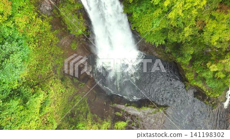 A dynamic view of the Akiu Great Falls waterfall basin, captured from directly above. A dynamic view of the Akiu Great Falls waterfall basin, captured from directly above. 141198302