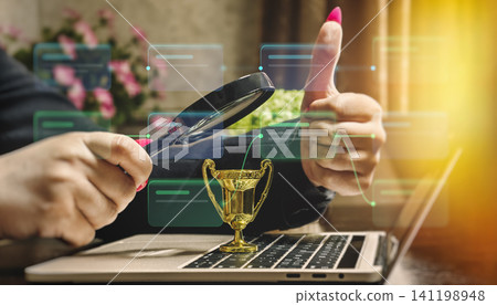 Successful business strategy and project approval concept. Thumbs up gesture, magnifying glass, and winner trophy with digital network diagram. Successful business strategy and project approval concept. Thumbs up gesture, magnifying glass, and winner trophy with digital network diagram. 141198948