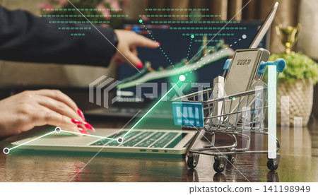 Buying precious metals online concept. E-commerce shopping cart with silver bars and digital stock market growth graphs. Buying precious metals online concept. E-commerce shopping cart with silver bars and digital stock market growth graphs. 141198949