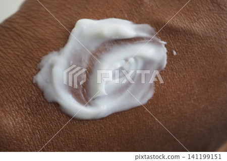 Applying cream on skin for moisture and care Applying cream on skin for moisture and care 141199151