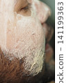 Relaxing facial treatment in spa setting 141199363