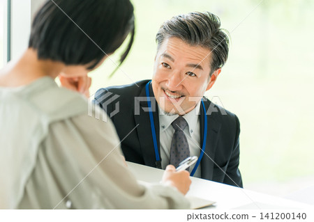 Male teachers and instructors in suits who teach at cram schools, after-school programs, or school classes and summer courses. Male teachers and instructors in suits who teach at cram schools, after-school programs, or school classes and summer courses. 141200140