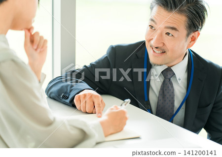 Male teachers and instructors in suits who teach at cram schools, after-school programs, or school classes and summer courses. Male teachers and instructors in suits who teach at cram schools, after-school programs, or school classes and summer courses. 141200141