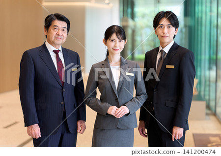 Asian hotel staff standing at the entrance 141200474