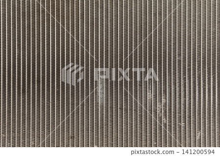 Close up of metal radiator cooling fins repeating industrial pattern detailed heat exchanger surface for engineering manufacturing background mechanical design 141200594