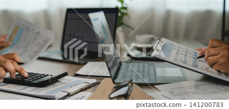 business planning financial documents laptops on an office desk, using spreadsheets and reports for business planning, data analysis, and investment reporting workflow. business planning financial documents laptops on an office desk, using spreadsheets and reports for business planning, data analysis, and investment reporting workflow. 141200783