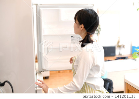 The life of a young Asian woman opening her refrigerator The life of a young Asian woman opening her refrigerator 141201135