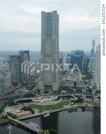 An aerial view overlooking Yokohama Landmark Tower and the Minato Mirai cityscape. 141201524