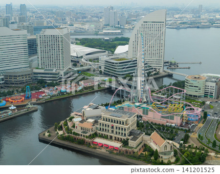 A vast urban landscape overlooking the tourist attractions and Ferris wheel of Minato Mirai. A vast urban landscape overlooking the tourist attractions and Ferris wheel of Minato Mirai. 141201525