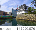 The Ushitora Turret (former Taiko Turret site) at Takamatsu Castle Ruins (Tamamo Castle Ruins/Tamamo Park) and a JR Shikoku train - Takamatsu City, Kagawa Prefecture 141201670