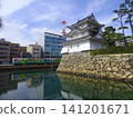 The Ushitora Turret (former Taiko Turret site) at Takamatsu Castle Ruins (Tamamo Castle Ruins/Tamamo Park) and a train of the Takamatsu Kotohira Electric Railway - Takamatsu City, Kagawa Prefecture 141201671