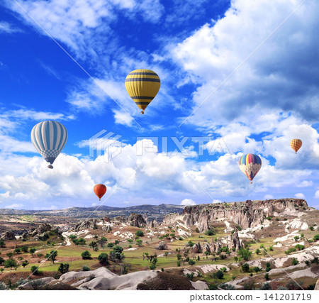 Balloon flight, famous tourist attraction of Cappadocia. Air balloons and Fairy Chimney in Pasabag Valley, Anatolia, Turkey. Topic of vacation, travel, trip abroad on vacation, cruises and tours 141201719
