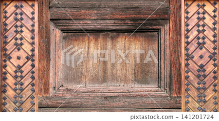 Texture of vintage wood board with decorative border with metal rivets. Vertical or horizontal retro background with old wooden plank and aged iron reinforcement. Copy space for text. Mock up template Texture of vintage wood board with decorative border with metal rivets. Vertical or horizontal retro background with old wooden plank and aged iron reinforcement. Copy space for text. Mock up template 141201724