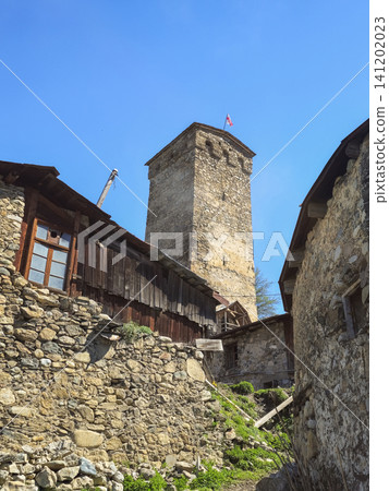 Medieval Svan Tower and traditional stone houses in the ancient mountain village of Mestia, Svaneti region, Georgia. Medieval Svan Tower and traditional stone houses in the ancient mountain village of Mestia, Svaneti region, Georgia. 141202023
